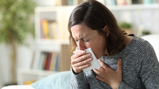 coughing woman